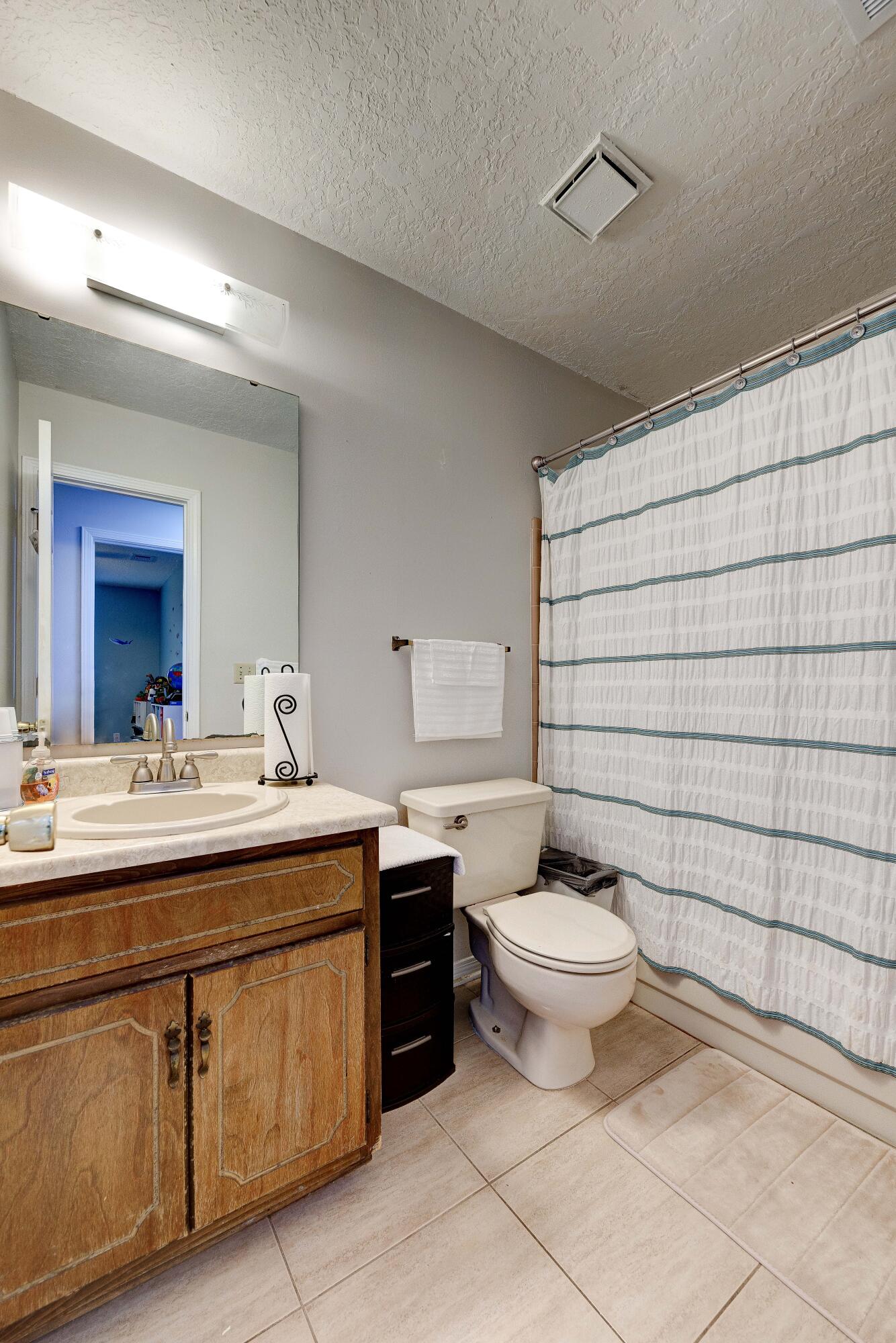 104 Fairoaks Drive Crestview, FL 32539 - Photo 22 of 24 a bathroom with a toilet sink and mirror