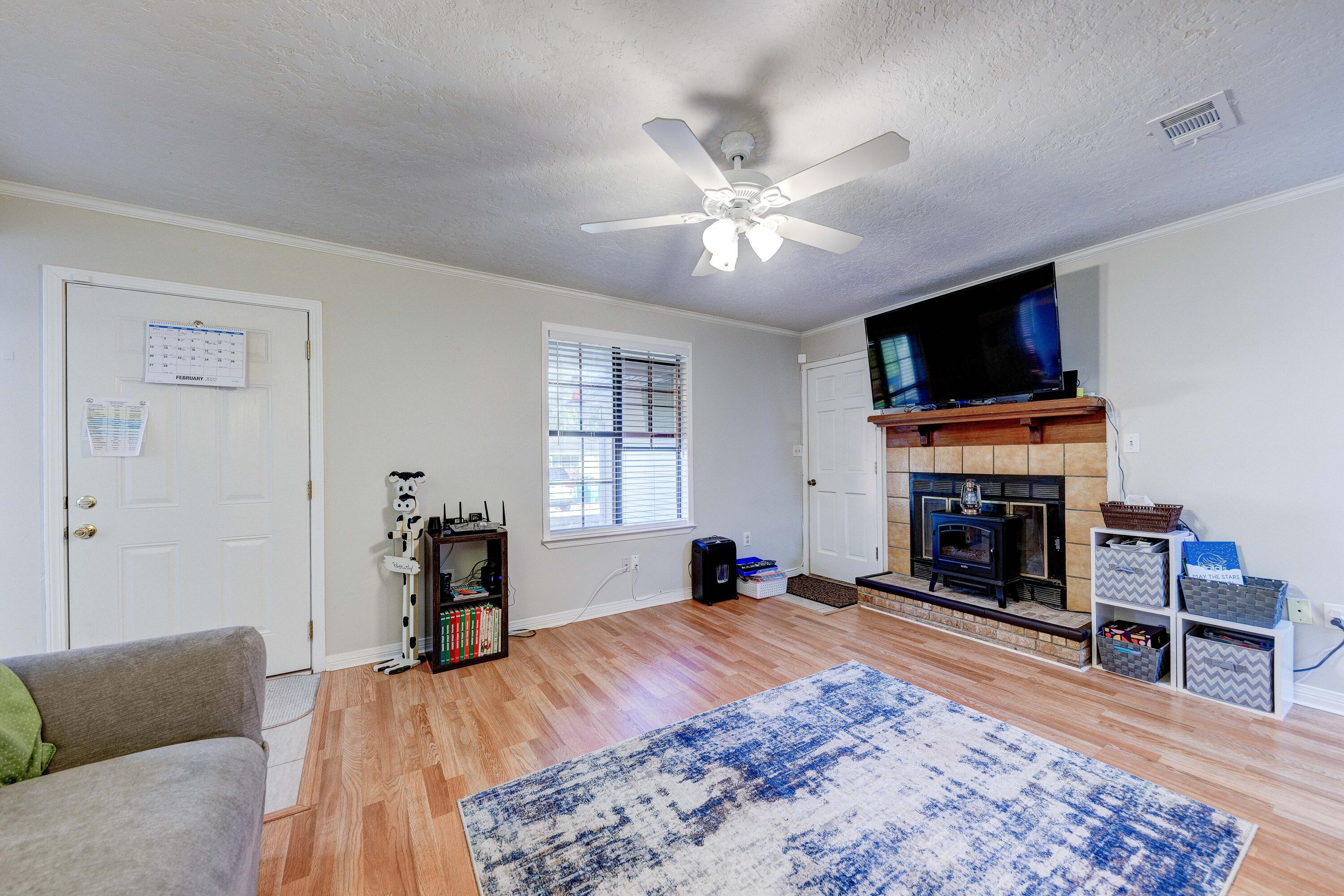 104 Fairoaks Drive Crestview, FL 32539 - Photo 4 of 24 a bed room with a bed and a fireplace