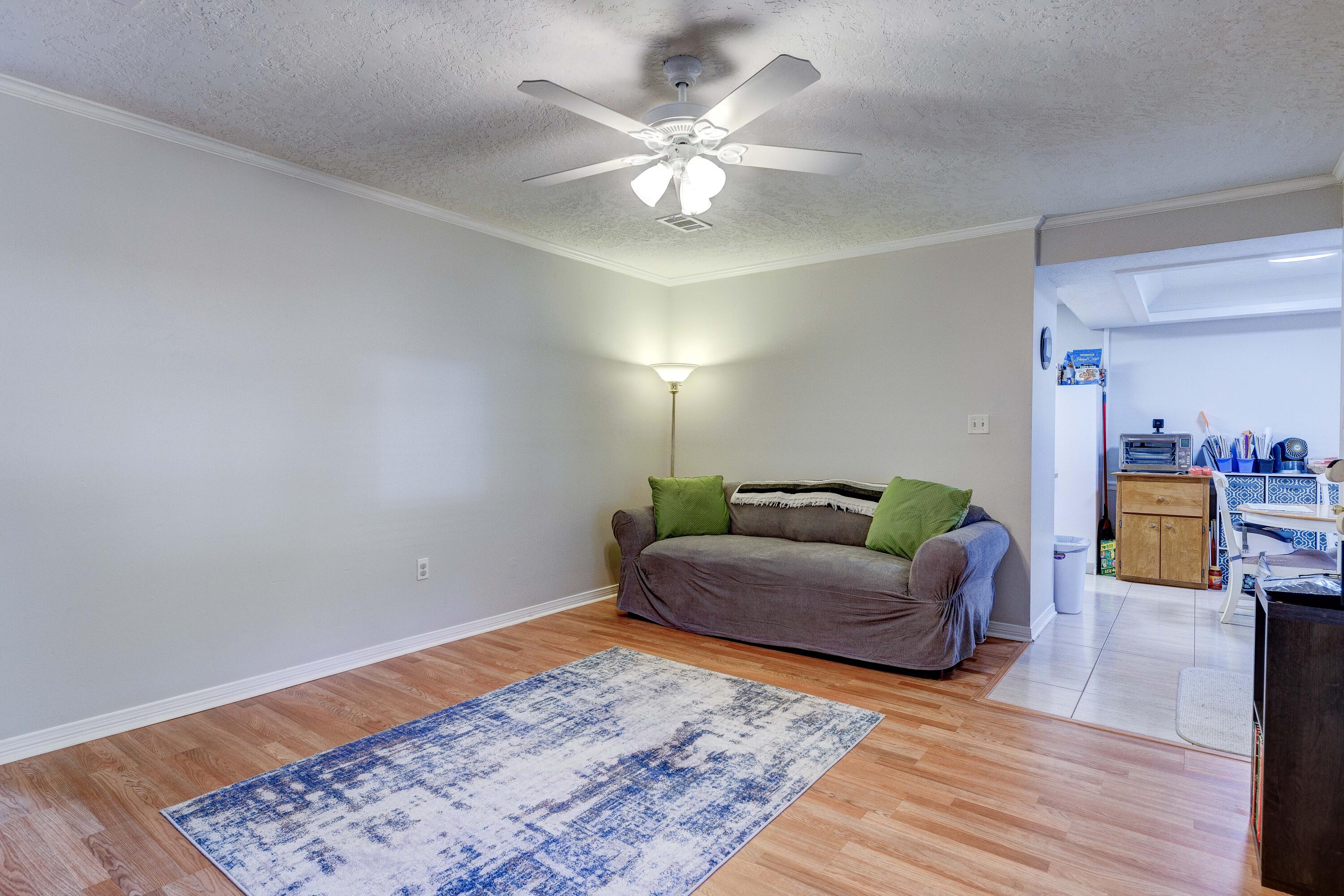 104 Fairoaks Drive Crestview, FL 32539 - Photo 7 of 24 a living room with furniture and a rug