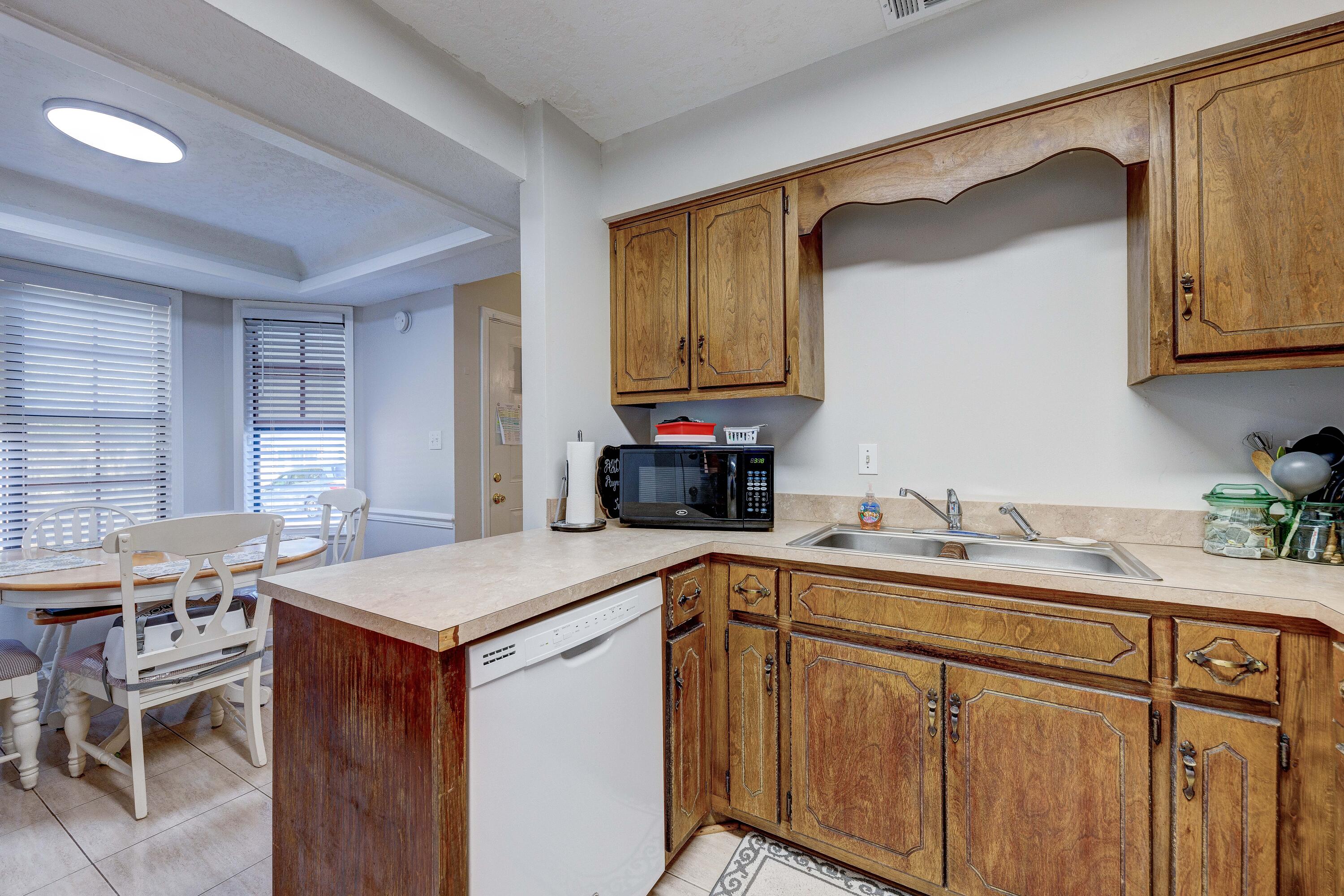 104 Fairoaks Drive Crestview, FL 32539 - Photo 10 of 24 a kitchen that has a sink and a stove in it
