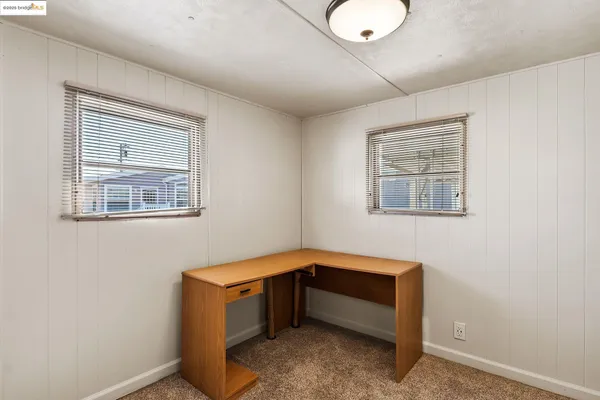 a room with a bed and a window