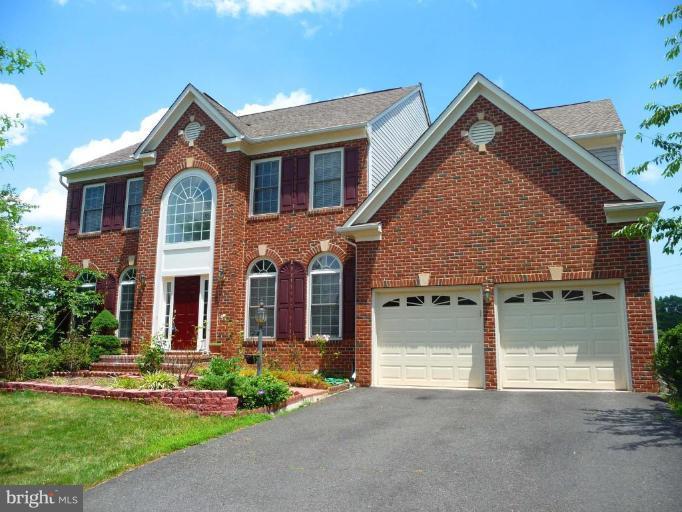 6089 Deer Ridge Trail Springfield, VA 22150 - Photo 1 of 30 front view of a house with a yard