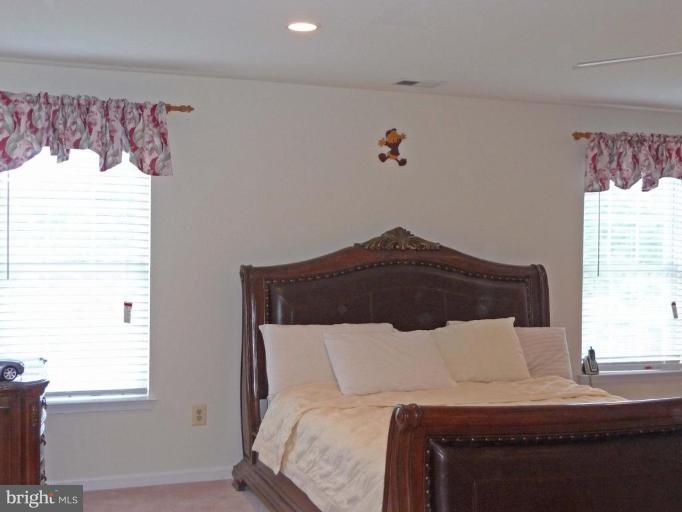 6089 Deer Ridge Trail Springfield, VA 22150 - Photo 15 of 30 a bedroom with a bed and a window