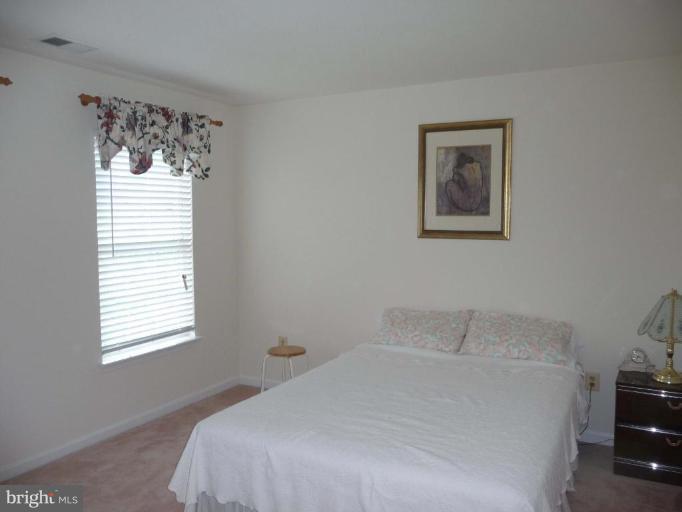 6089 Deer Ridge Trail Springfield, VA 22150 - Photo 21 of 30 a bedroom with a bed and a window