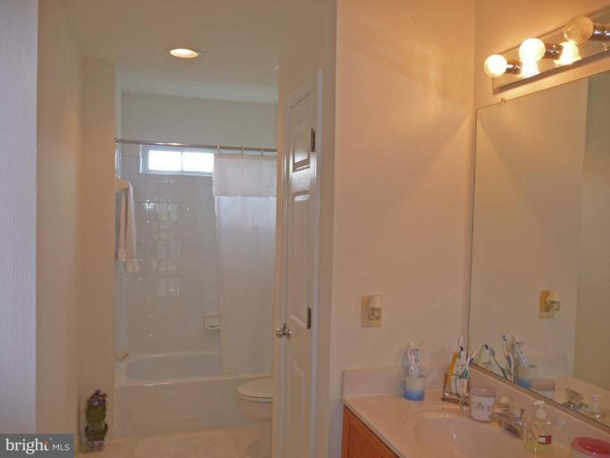 6089 Deer Ridge Trail Springfield, VA 22150 - Photo 23 of 30 a bathroom with a sink and a mirror