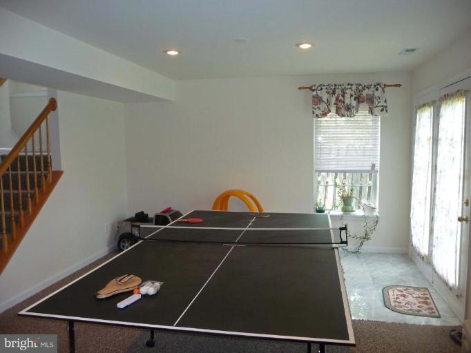 6089 Deer Ridge Trail Springfield, VA 22150 - Photo 27 of 30 a room with gym equipment and windows