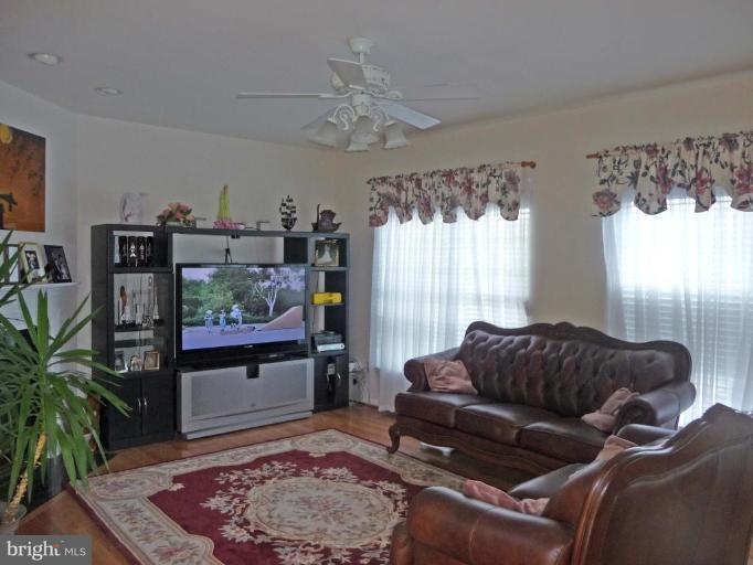 6089 Deer Ridge Trail Springfield, VA 22150 - Photo 8 of 30 a living room with furniture and a large window