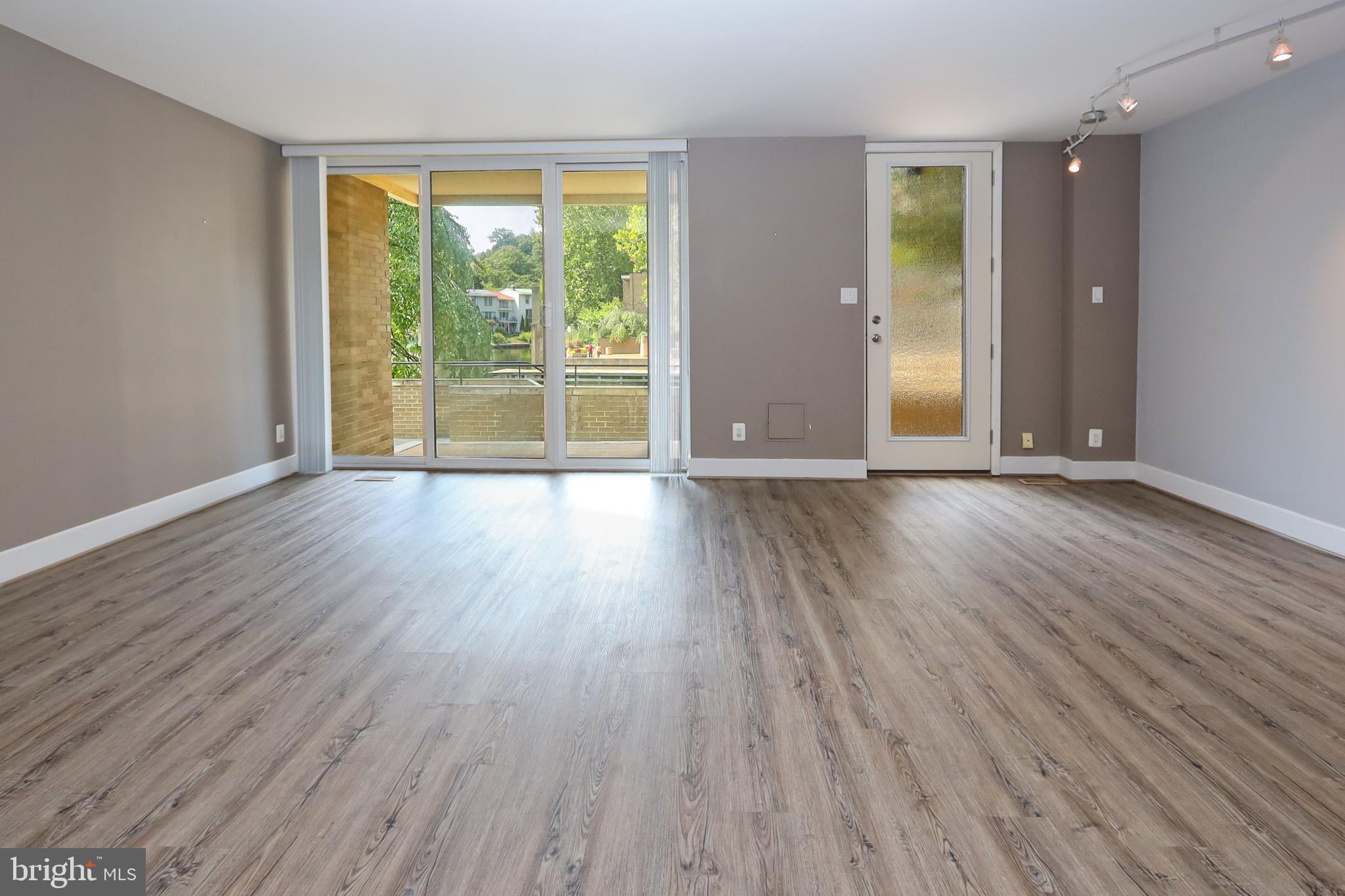 1682 Chimney House Road Reston, VA 20190 - Photo 34 of 56 Luxury vinyl tile in the rec room