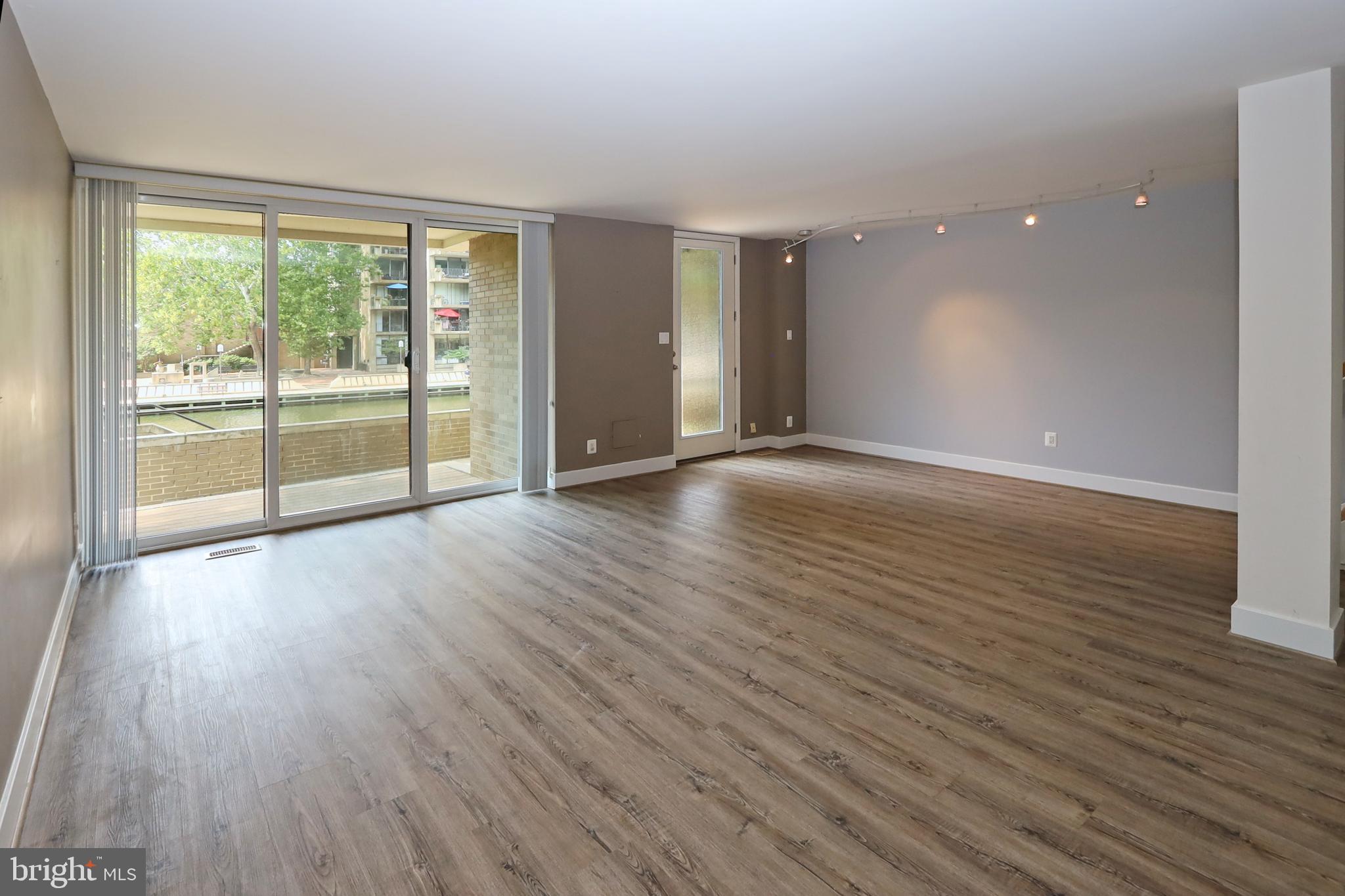 1682 Chimney House Road Reston, VA 20190 - Photo 35 of 56 Floor-to-ceiling sliders and atrium door to deck