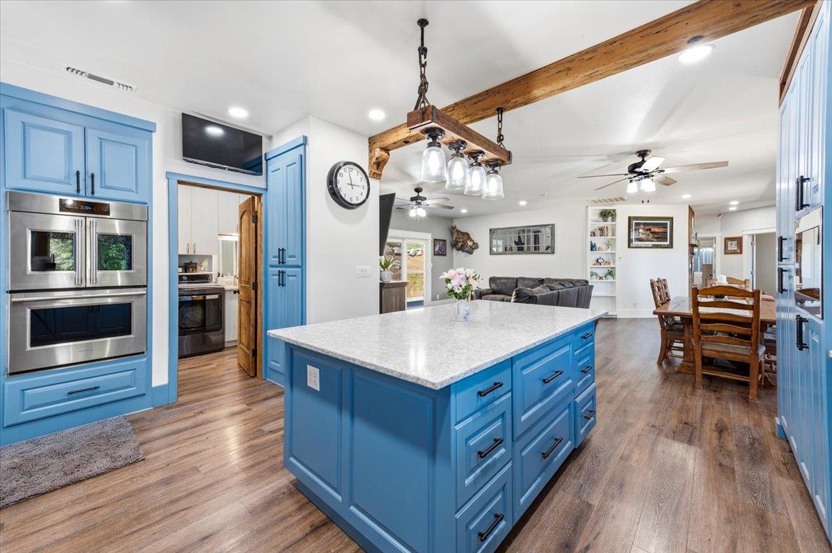 10784 Cole Way Grass Valley, CA 95945 - Photo 12 of 57 a kitchen with stainless steel appliances granite countertop a stove and cabinets