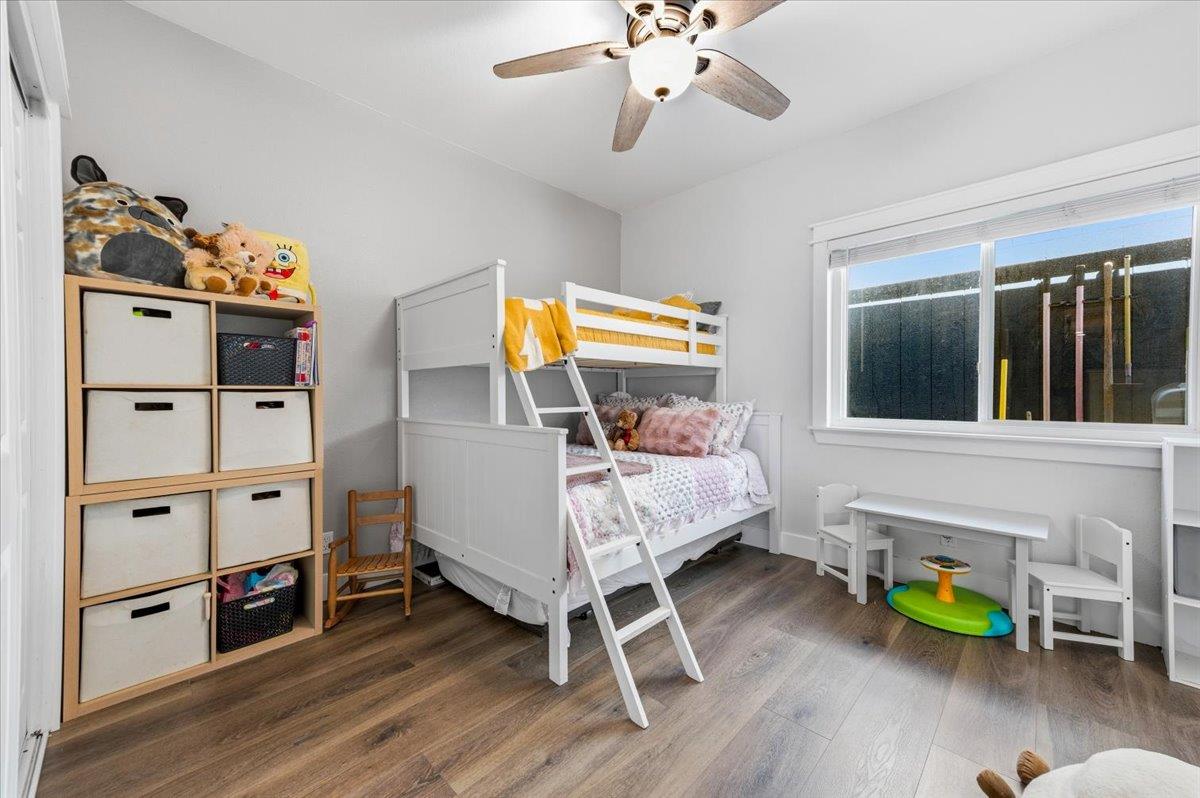 10784 Cole Way Grass Valley, CA 95945 - Photo 17 of 57 a bedroom with a bed and wooden floor