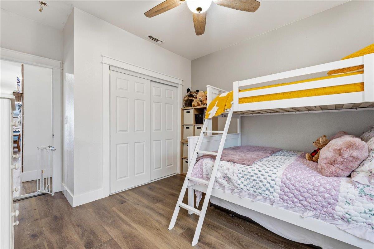 10784 Cole Way Grass Valley, CA 95945 - Photo 18 of 57 a bedroom with a bed and a chandelier