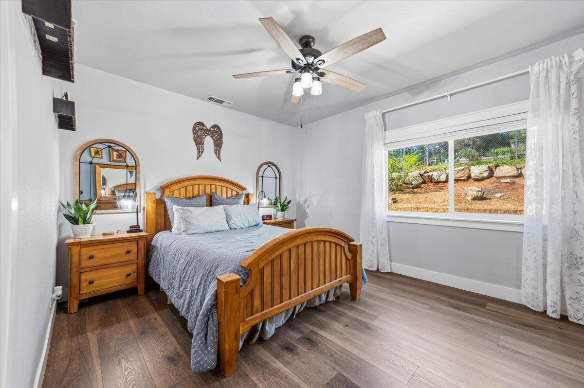 10784 Cole Way Grass Valley, CA 95945 - Photo 21 of 57 a bedroom with bed and a window