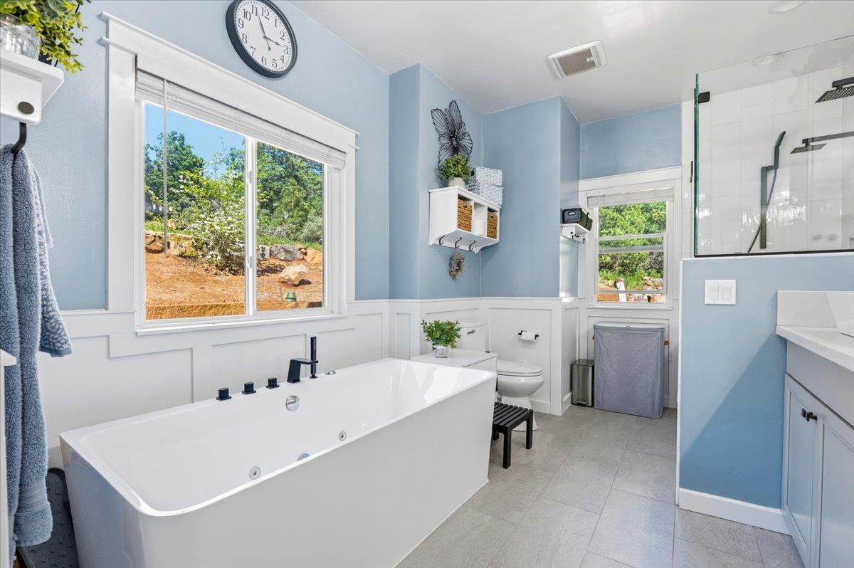 10784 Cole Way Grass Valley, CA 95945 - Photo 25 of 57 a white bath tub sitting next to a white sink