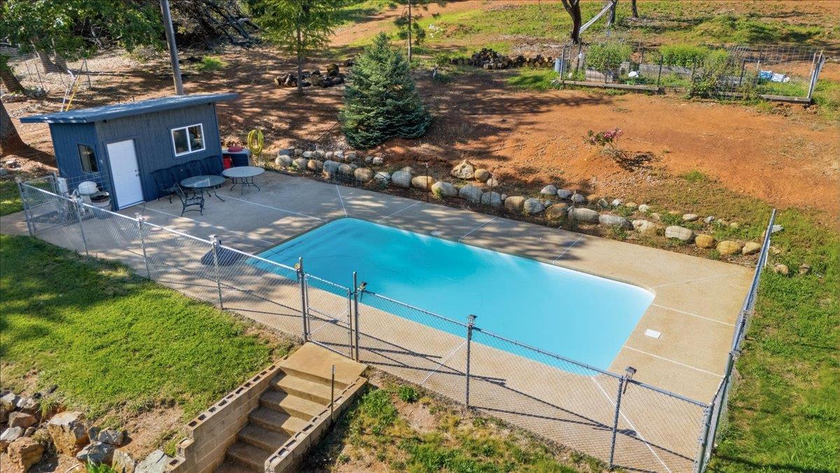 10784 Cole Way Grass Valley, CA 95945 - Photo 36 of 57 Pool is fully fenced and has a pool house all locate behind the house.