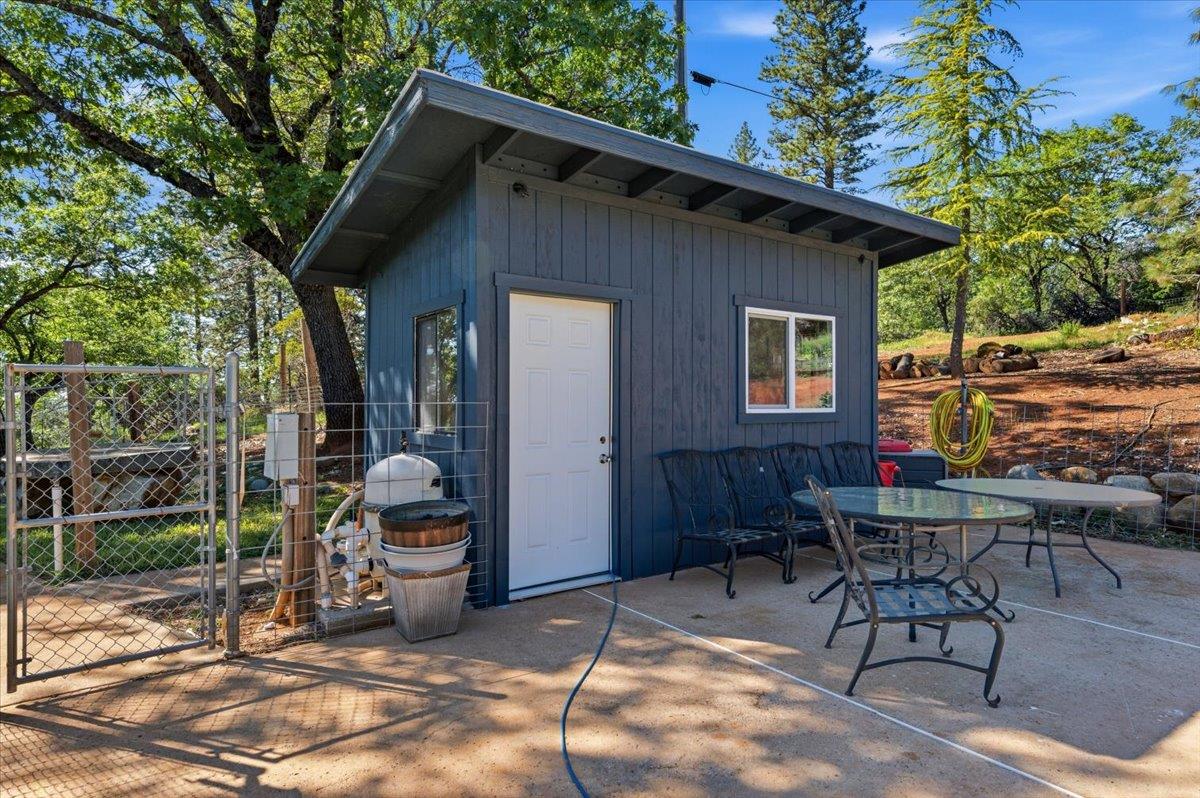 10784 Cole Way Grass Valley, CA 95945 - Photo 39 of 57 a view of backyard with outdoor seating and a trees