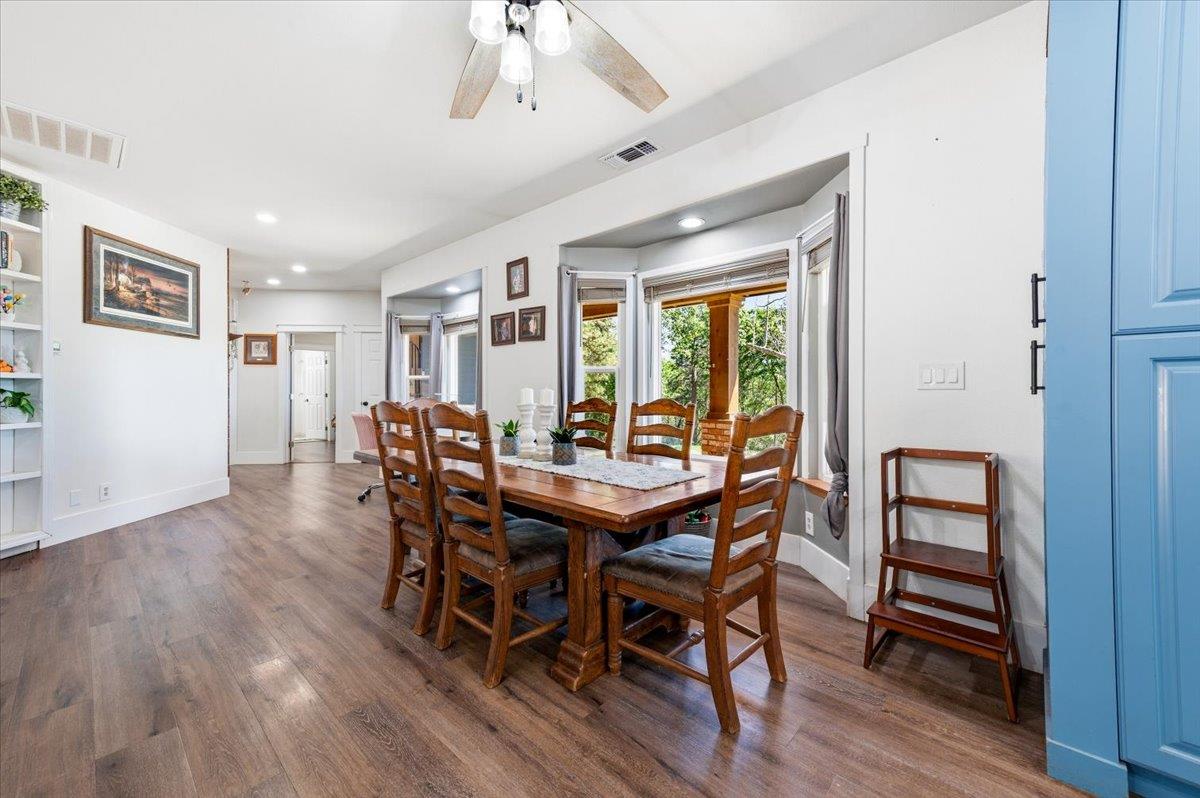 10784 Cole Way Grass Valley, CA 95945 - Photo 9 of 57 a view of a dining room with furniture and wooden floor
