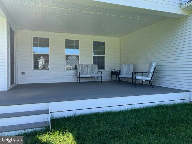 a view of backyard with seating space