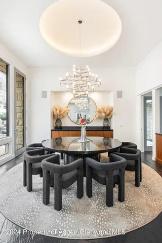 a dining room with table and chairs