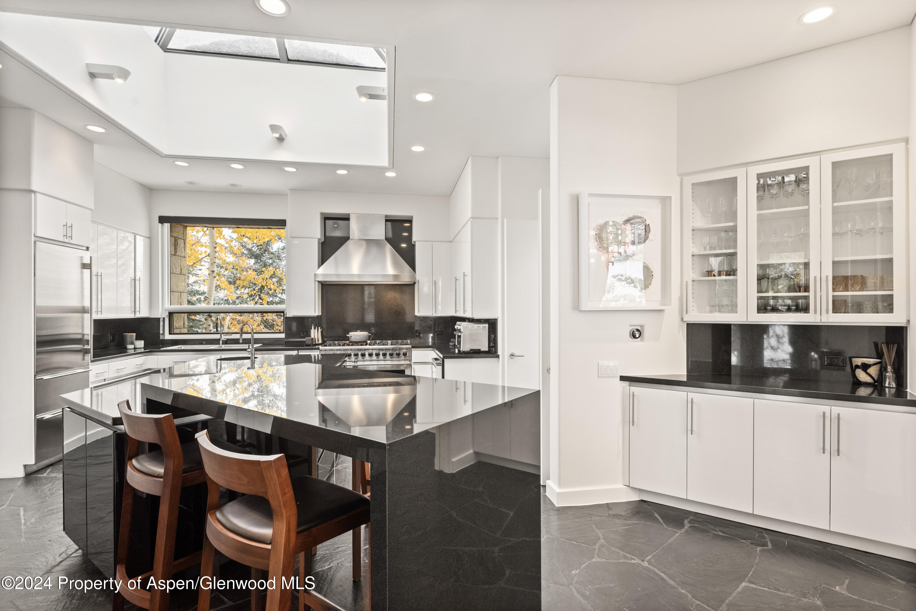 189 Aspen Way Snowmass Village, CO 81615 - Photo 14 of 44 a kitchen with a sink stove and cabinets