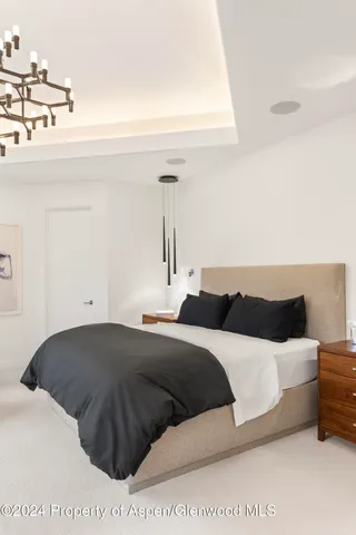 a bedroom with a bed and a cabinets