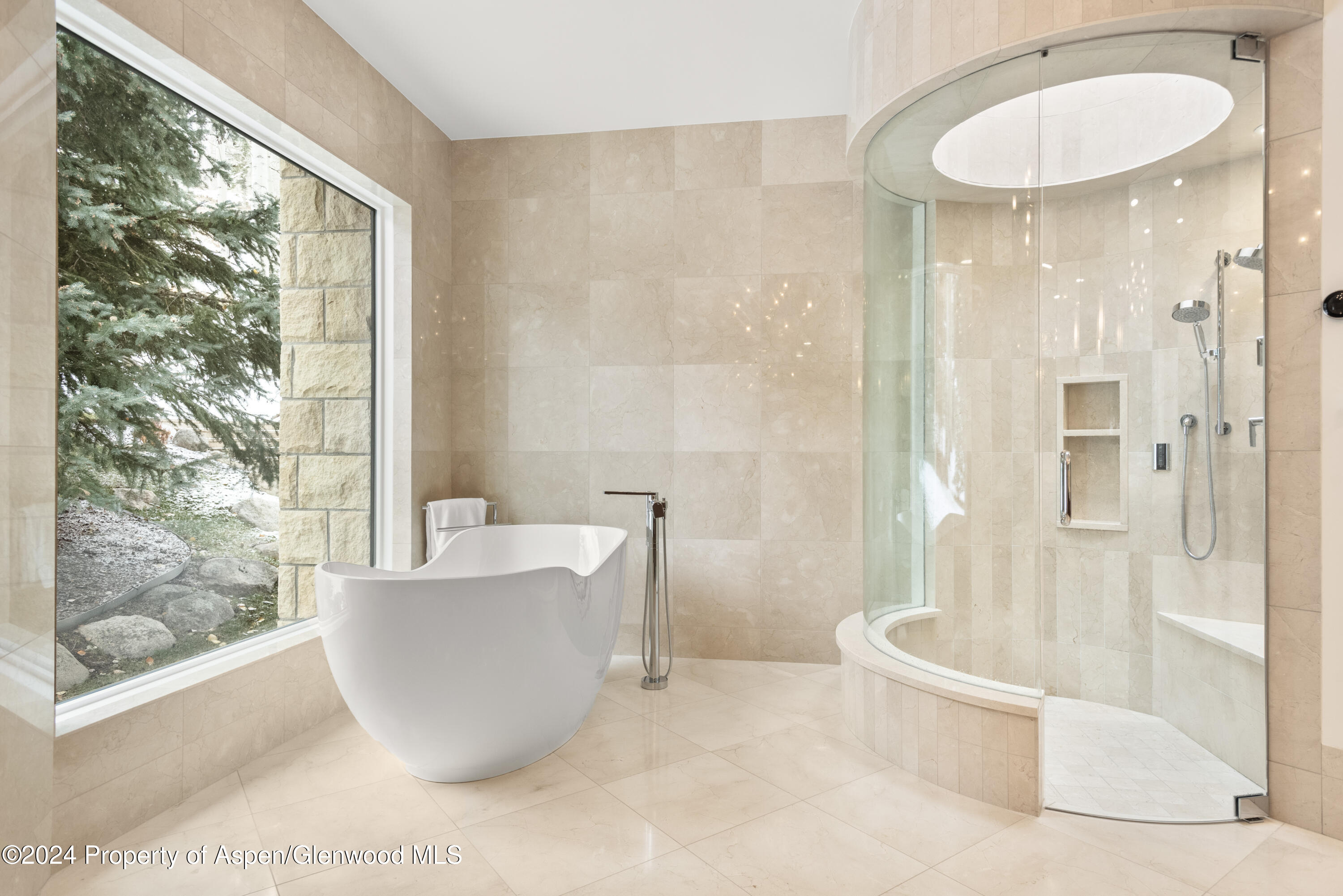 189 Aspen Way Snowmass Village, CO 81615 - Photo 22 of 44 a living room with a large window and furniture