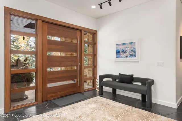 a view of a living room and entry way