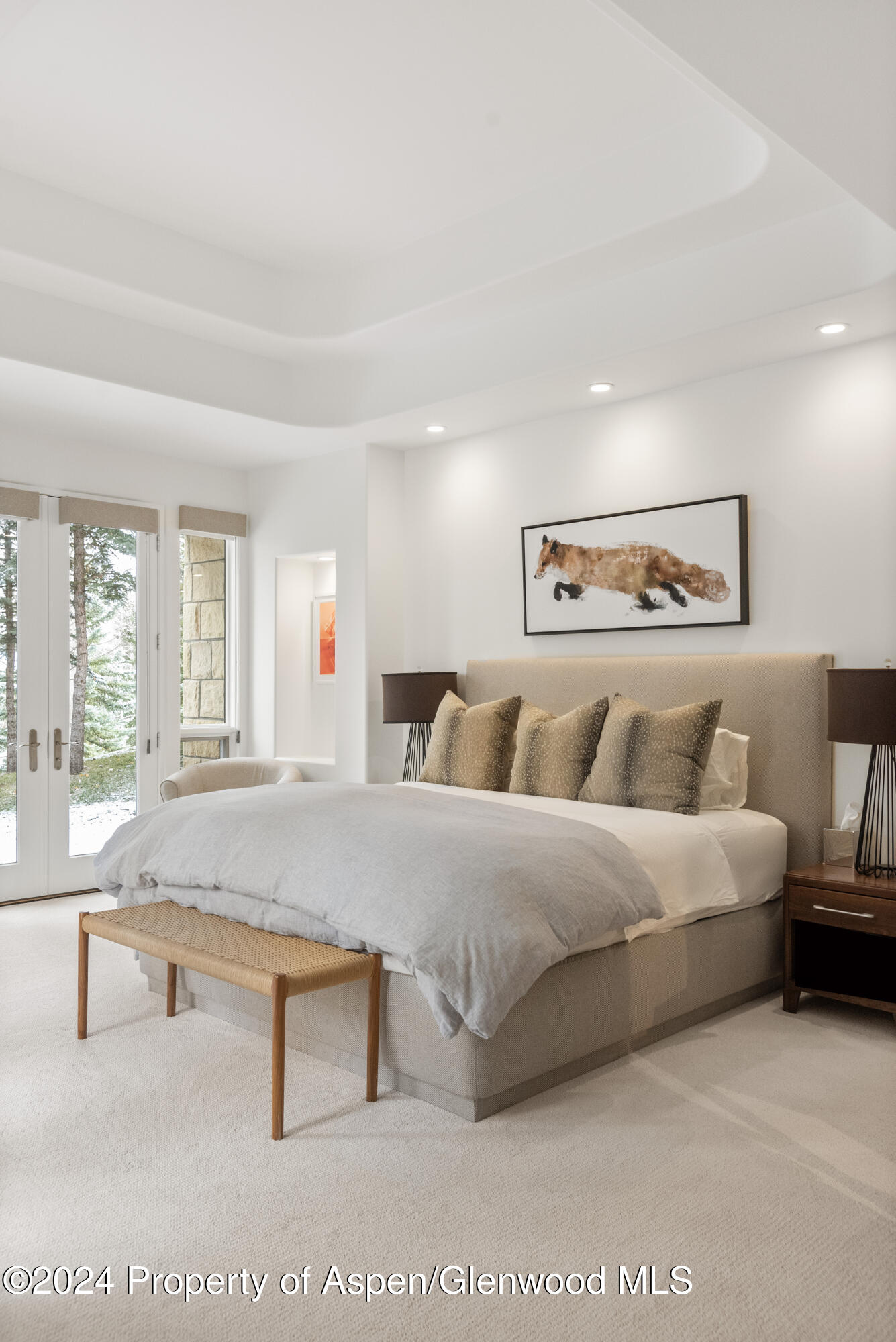 189 Aspen Way Snowmass Village, CO 81615 - Photo 35 of 44 a spacious bedroom with a bed and a couch