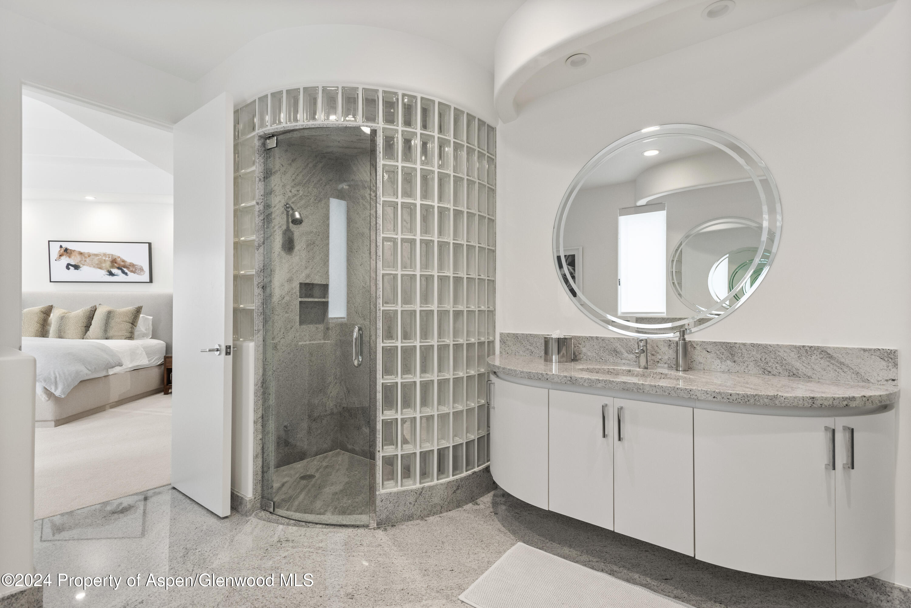 189 Aspen Way Snowmass Village, CO 81615 - Photo 36 of 44 a bathroom with a granite countertop sink a mirror and shower