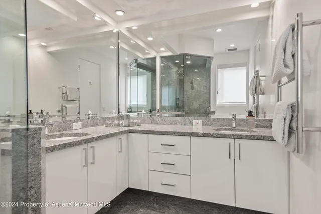 a bedroom with a bed and a desk