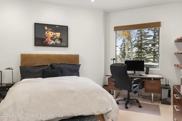 a bathroom with double sink and a mirror