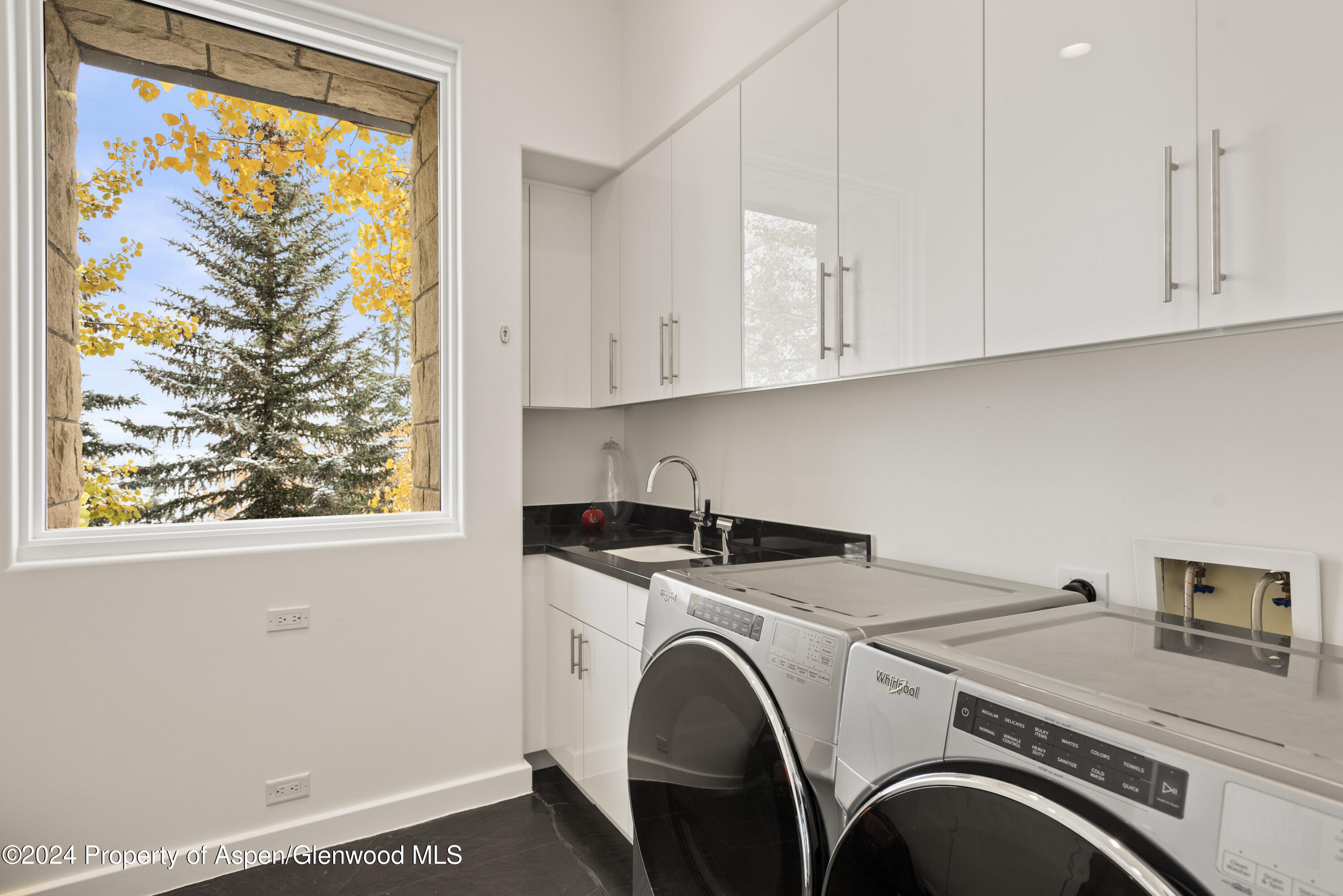 189 Aspen Way Snowmass Village, CO 81615 - Photo 41 of 44 a utility room with dryer and washer