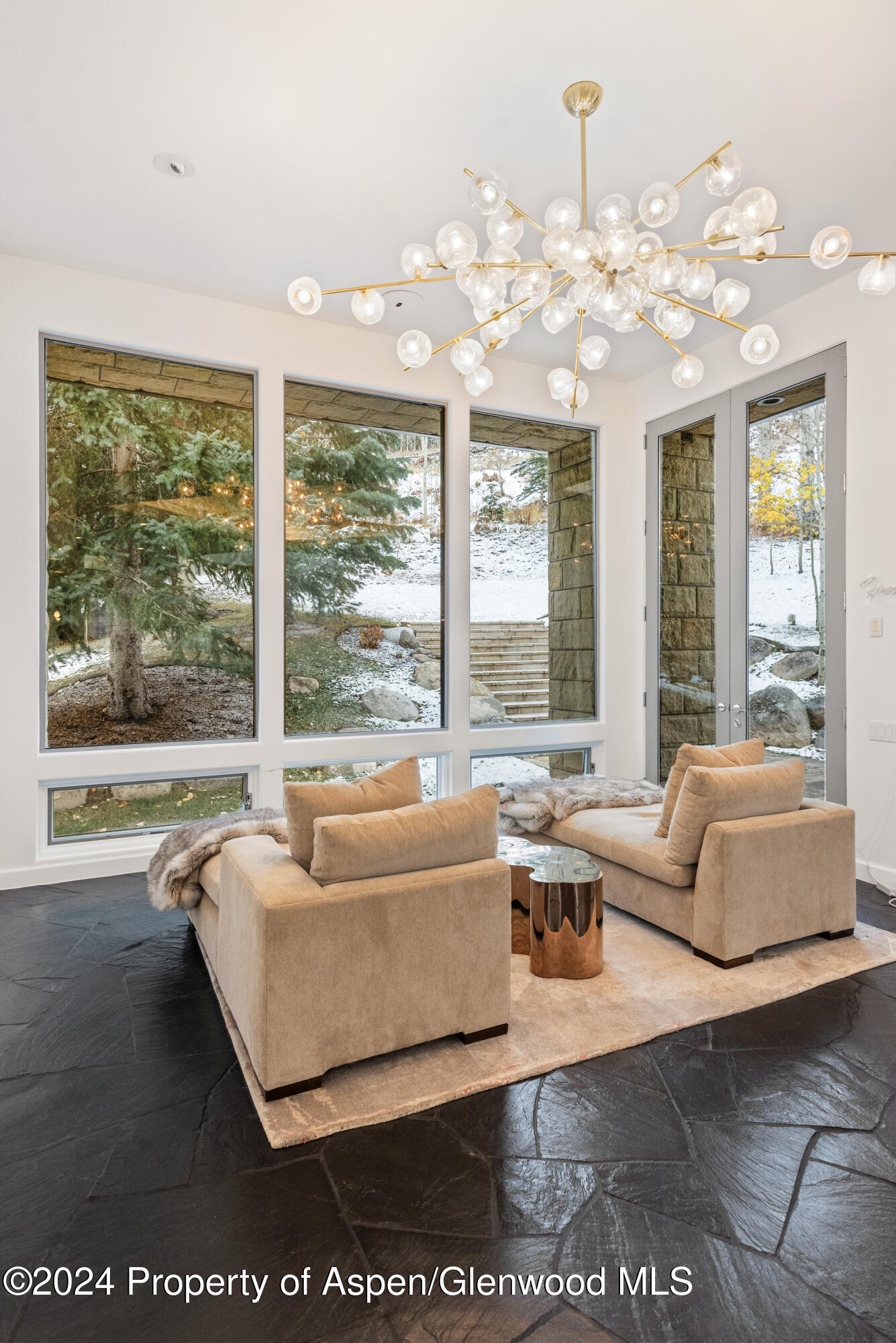 189 Aspen Way Snowmass Village, CO 81615 - Photo 5 of 44 a living room with furniture and large windows