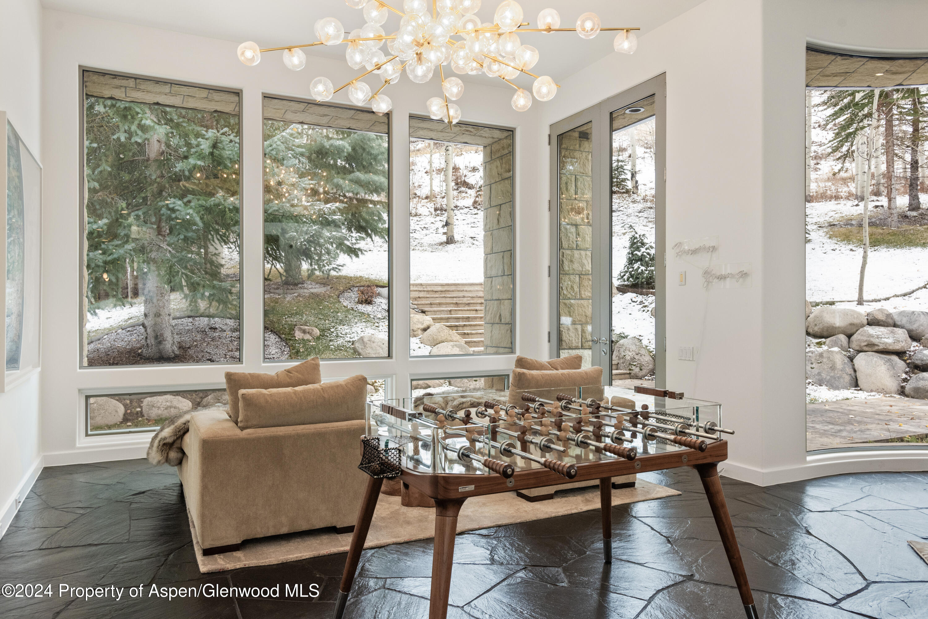 189 Aspen Way Snowmass Village, CO 81615 - Photo 6 of 44 a living room with furniture and a large window