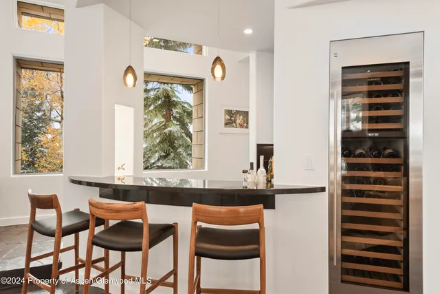 a view of a dining room with furniture and window