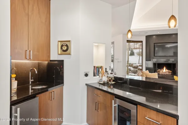 a kitchen with a sink and a refrigerator
