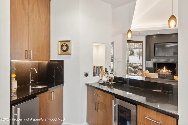 a kitchen with a sink and a refrigerator