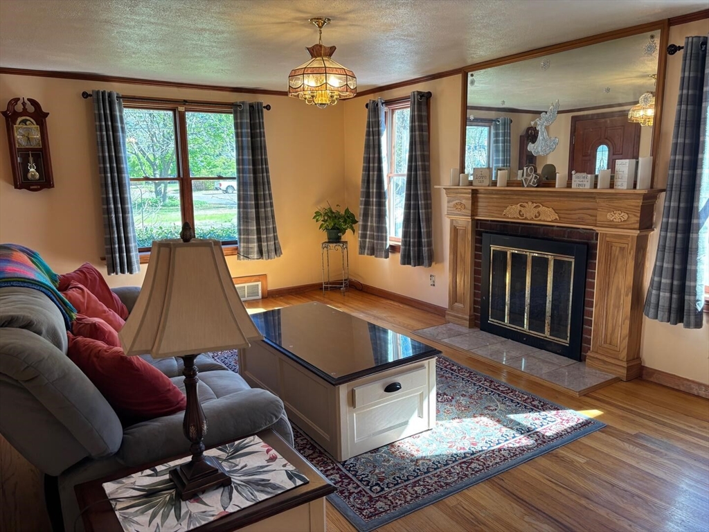 65 Brookside Circle Springfield, MA 01129 - Photo 13 of 25 a living room with furniture and a fireplace