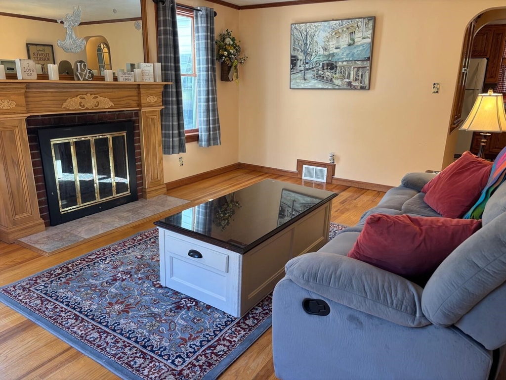 65 Brookside Circle Springfield, MA 01129 - Photo 14 of 25 a living room with furniture and a fireplace
