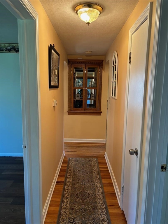65 Brookside Circle Springfield, MA 01129 - Photo 16 of 25 a view of hallway with wooden floor