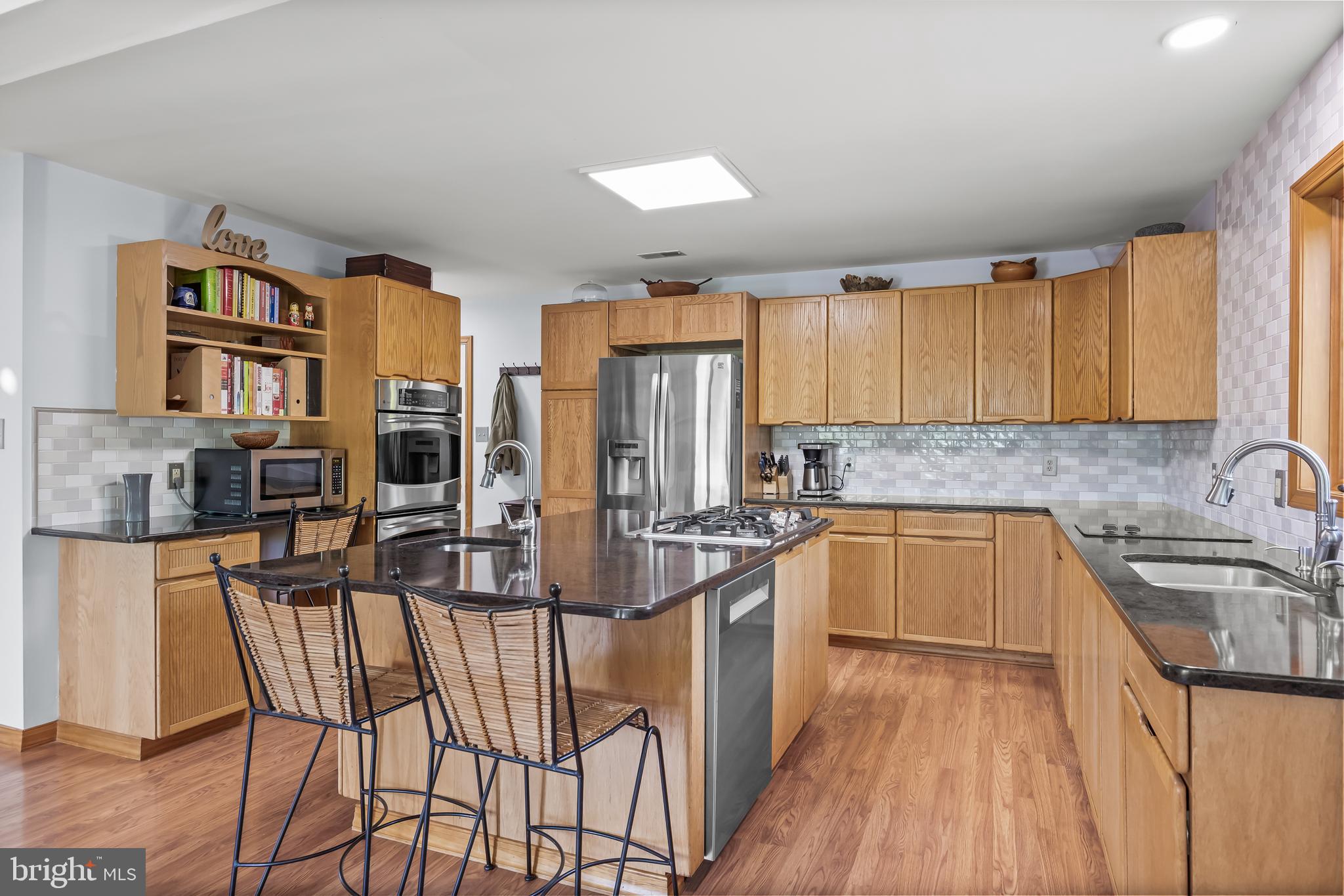 10 Marriott Drive Lumberton, NJ 08048 - Photo 16 of 60 a kitchen with stainless steel appliances granite countertop a stove top oven a sink dishwasher and cabinets with wooden floor