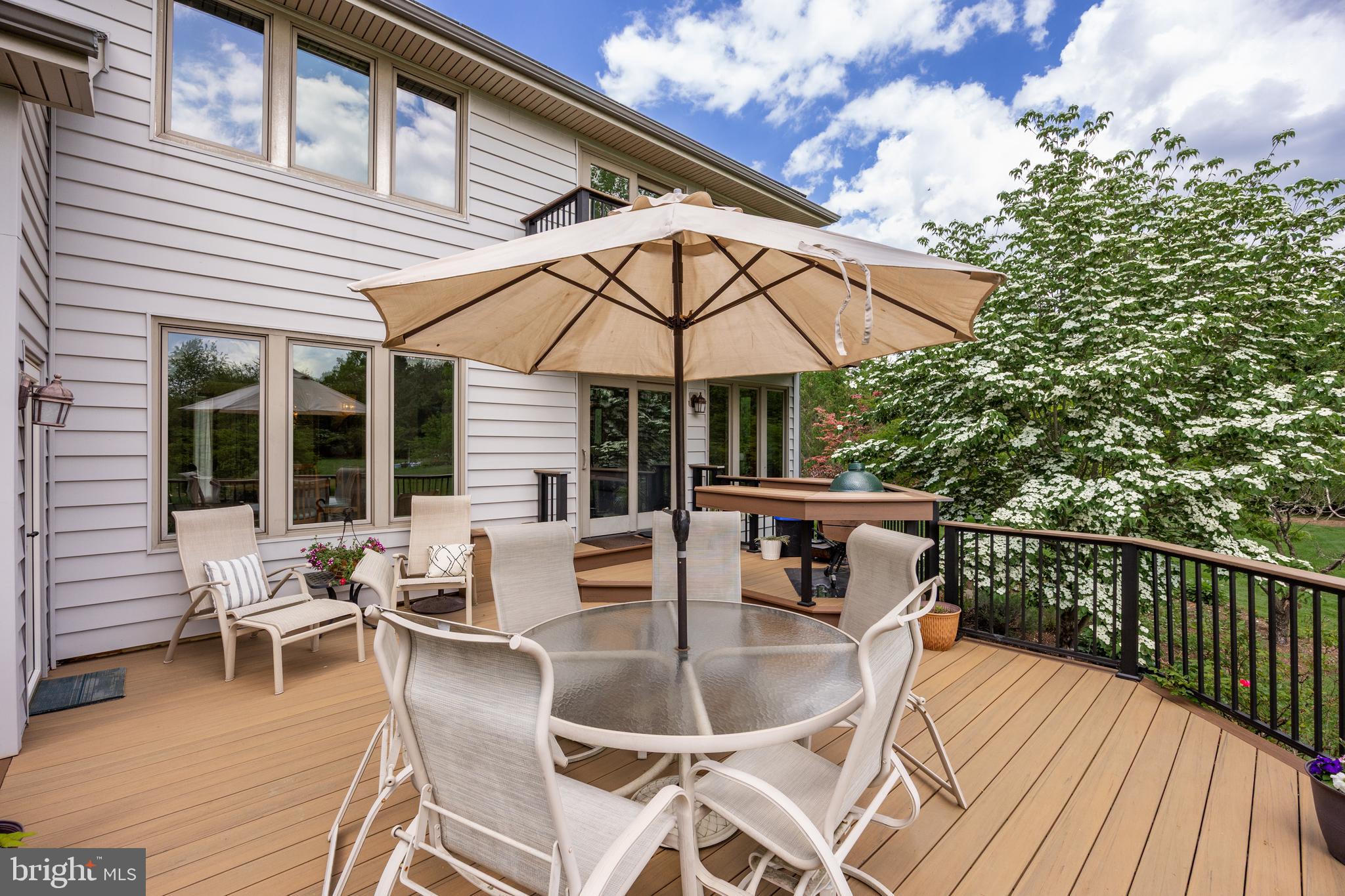 10 Marriott Drive Lumberton, NJ 08048 - Photo 45 of 60 a patio with wooden floor a yard a table and chairs