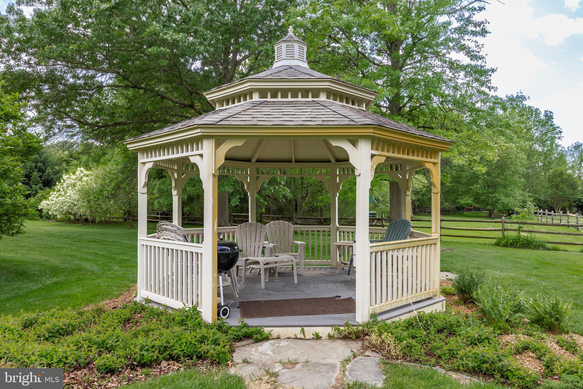 10 Marriott Drive Lumberton, NJ 08048 - Photo 50 of 60 a front view of a house with a yard table and chairs