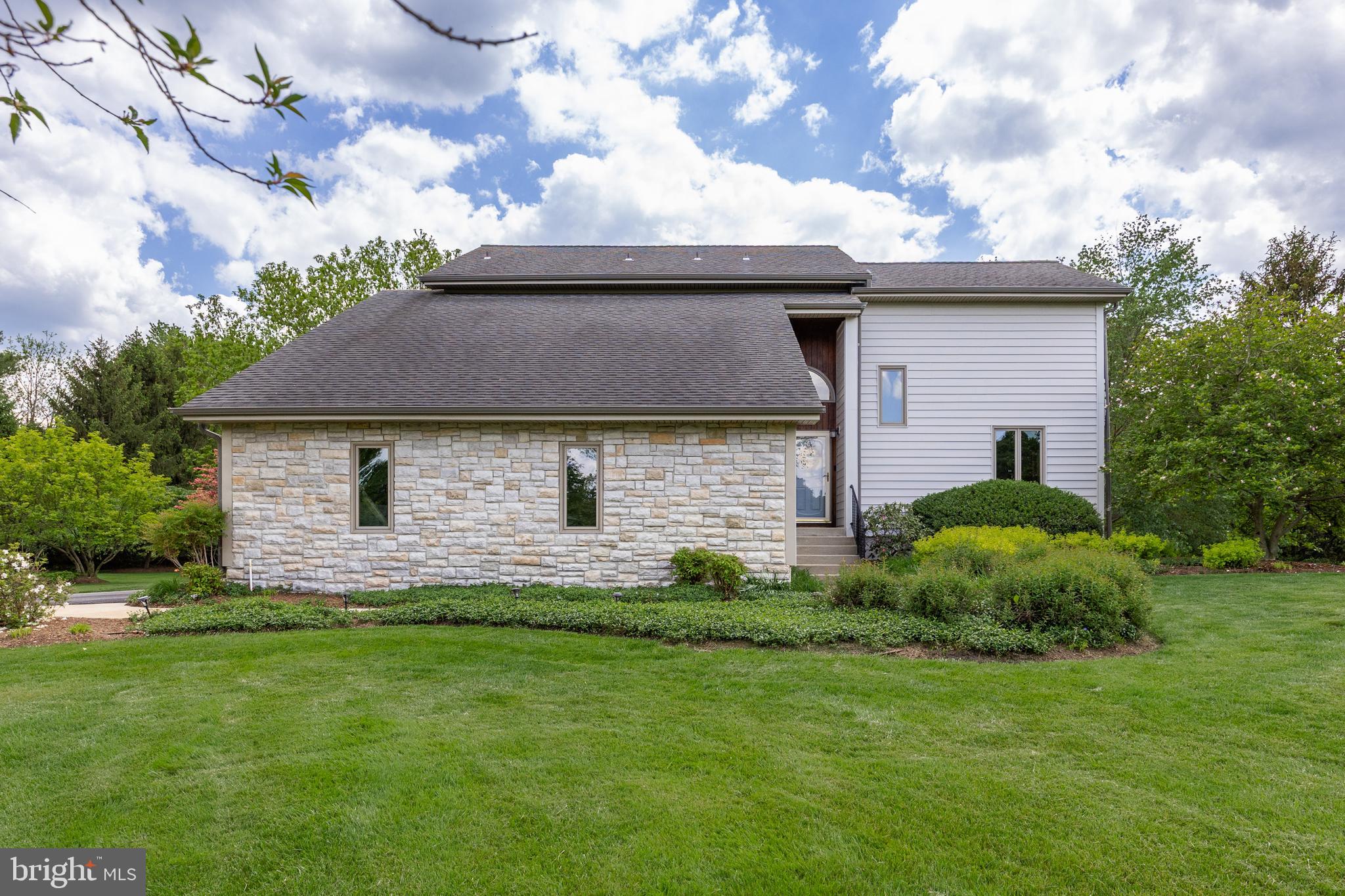 10 Marriott Drive Lumberton, NJ 08048 - Photo 6 of 60 a front view of a house with a garden and yard