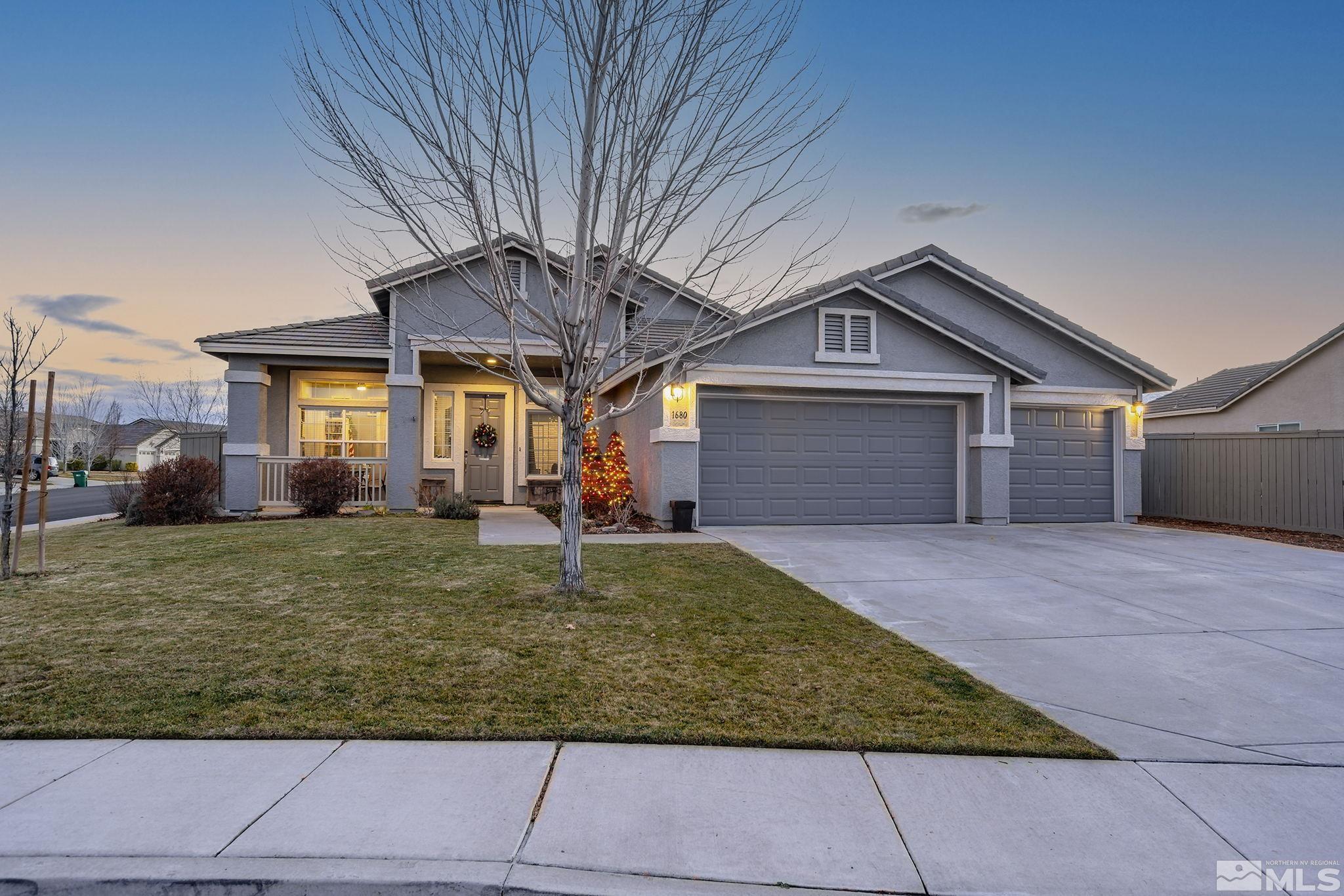 1680 Ghettis Way Reno, NV 89521 - Photo 1 of 35 a front view of a house with garden