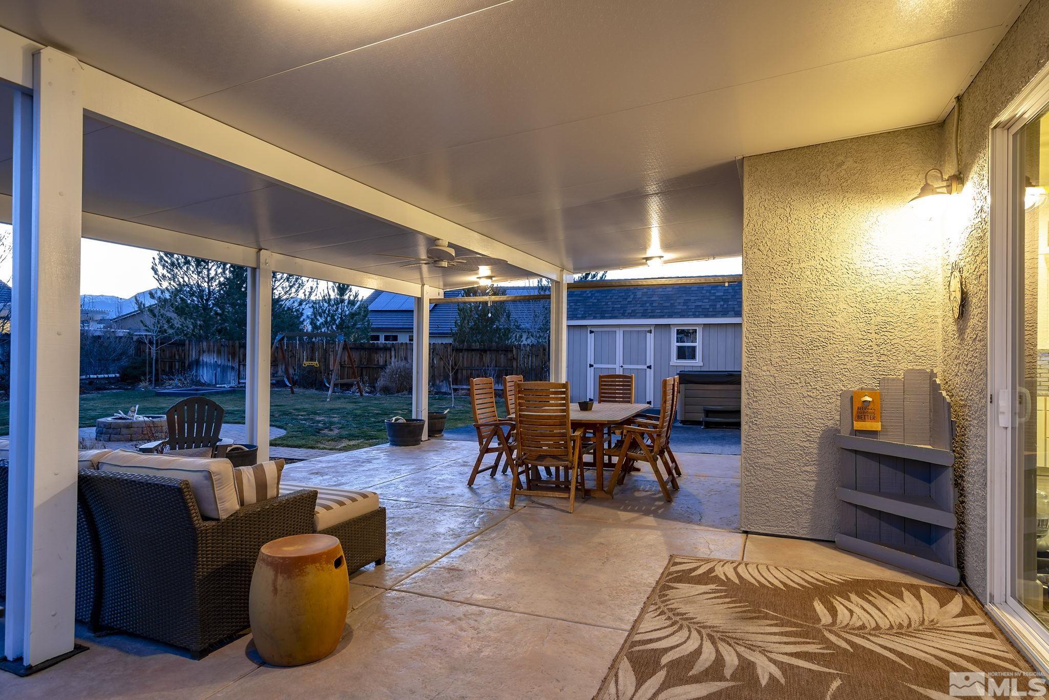 1680 Ghettis Way Reno, NV 89521 - Photo 23 of 35 a view of a patio with table and chairs