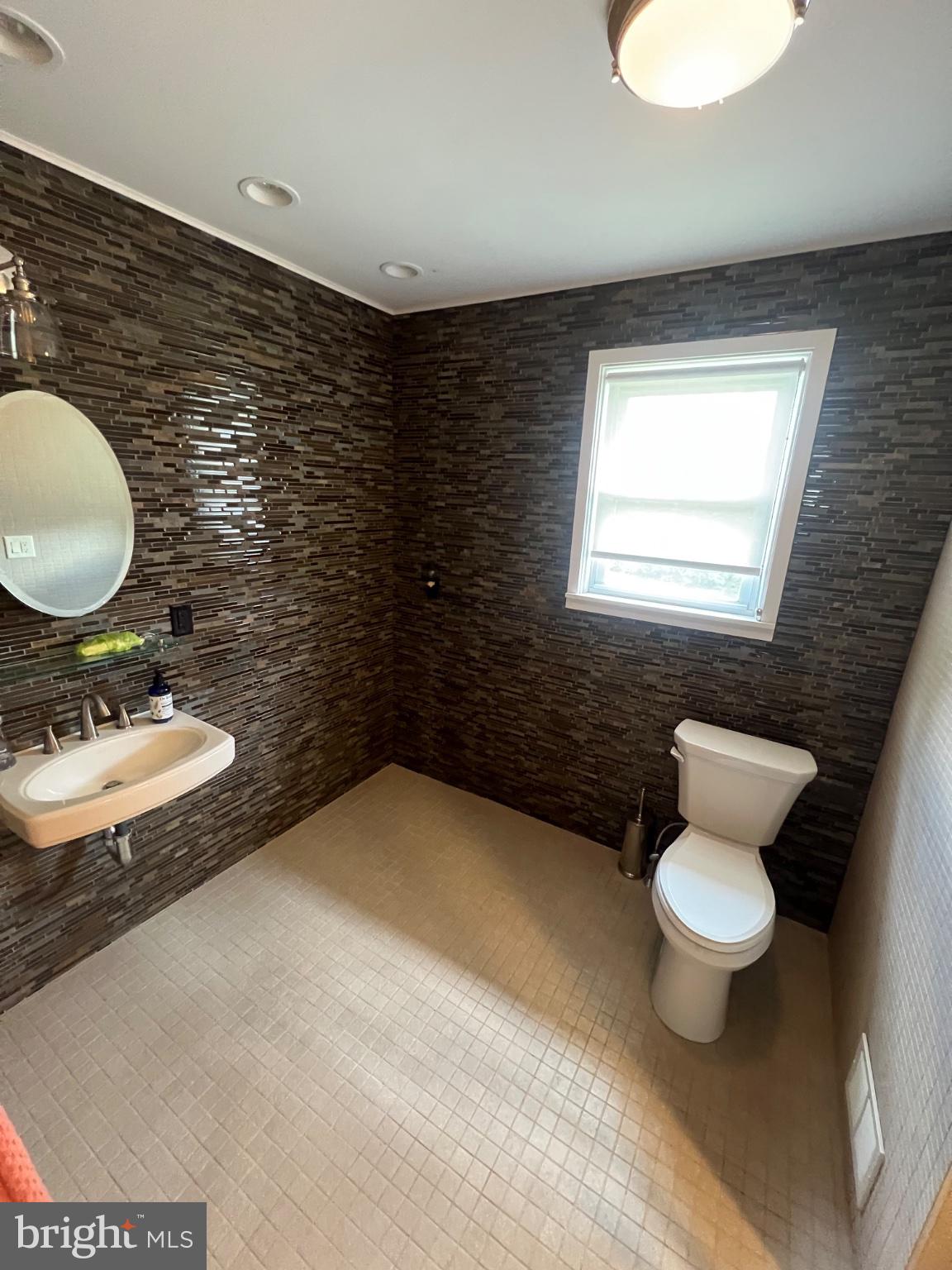 20 Fairview Road Swarthmore, PA 19081 - Photo 16 of 24 a bathroom with a toilet a sink and a mirror