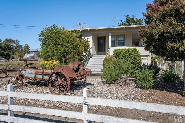 front view of a house with a bench