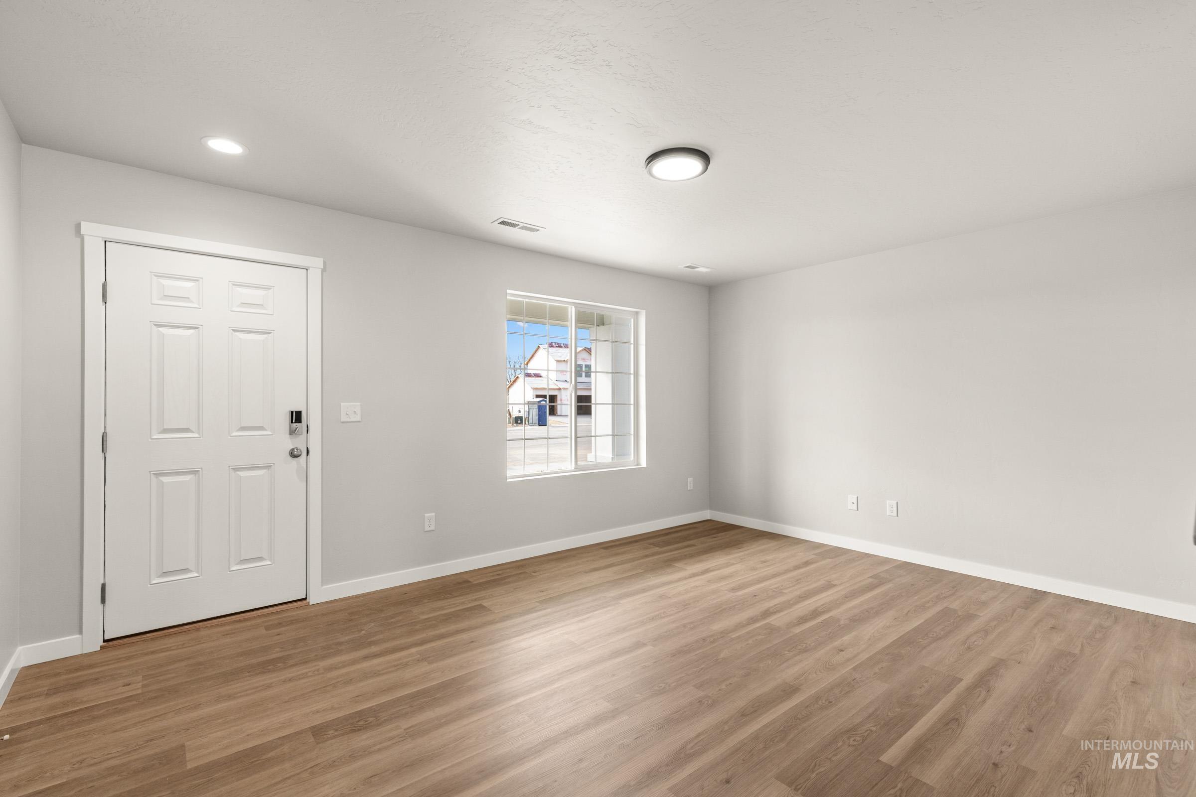13704 Redway Court Caldwell, ID 83607 - Photo 10 of 23 Entryway featuring wood finished floors and recessed lighting