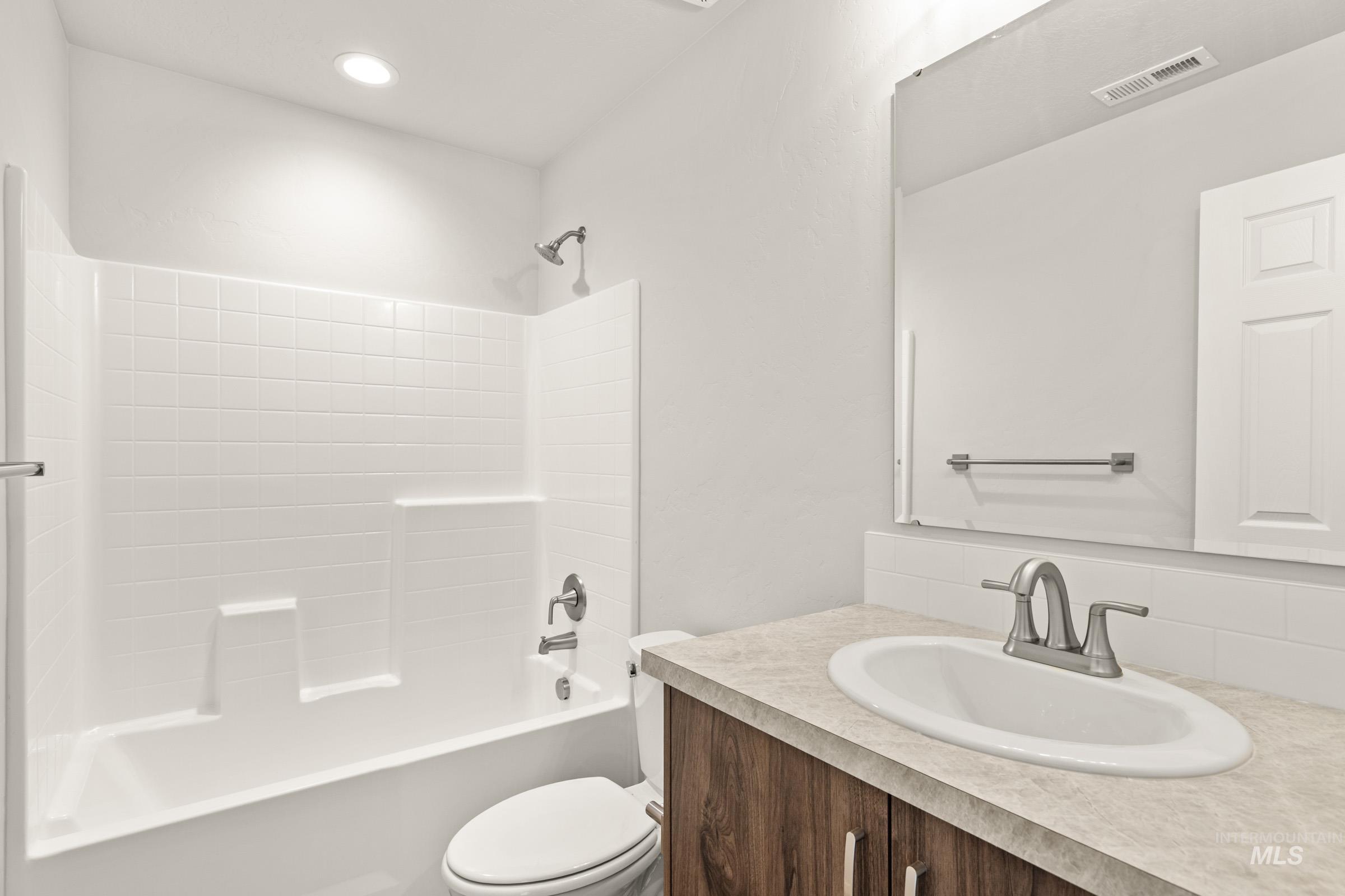 13704 Redway Court Caldwell, ID 83607 - Photo 21 of 23 Full bath featuring vanity and bathing tub / shower combination
